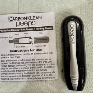 CarbonKlean Lens Cleaner in Black and Silver. One item